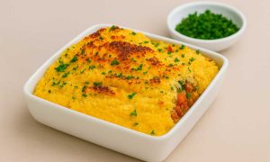 Pastel de mijo relleno de boloñesa de seitán de la Dra. María Pérez Benítez